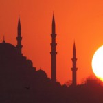 Sun sets over Ottoman-era Suleymaniye mosque in Istanbul