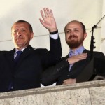 Turkish Prime Minister Tayyip Erdogan, accompanied by his son Bilal and daughter Sumeyye, greets his supporters in Ankara