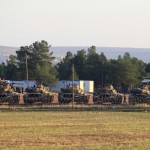 Tanks are positioned at a military base on the Turkish-Syrian border near the town of Suruc, in Sanliurfa province