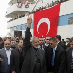 Hamas' Gaza leader Haniyeh flashes a victory sign to his supporters in front of the cruise liner Mavi Marmara in Istanbul