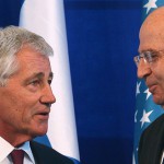 Israeli Defense Minister Ya'alon shakes hands with U.S. Defense Secretary Hagel during a joint news conference at The Kirya, the Israeli Defense Force headquarters, in Tel Aviv