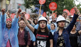 Alevi demonstrators shout anti-goverment slogans during a protest against the latest violence in Okmeydani, a working-class district in the center of the city, in Istanbul