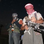 Iraqi_insurgents_with_guns