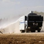 Turkish Kurdish protesters clash with Turkish security forces during a pro-Kurdish protest near the southeastern town of Suruc in Sanliurfa province