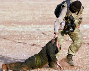 A Turkish police officer arrests an old Kurdish protester during a demonstration near Turkish-Syrian Kurdistan border Sanliurfa, Turkish Kurdistan. Photo credit: EPA