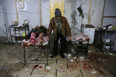  An injured man at a field hospital in Douma, Syria, this month, following what activists said was an airstrike by forces loyal to President Bashar al-Assad. Credit Bassam Khabieh/Reuters 