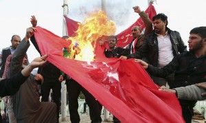 Protesters burn a Turkish flag during a demonstration calling for the withdrawal of Turkish troops from northern Iraq. Photograph: Nabil al-Jurani/AP