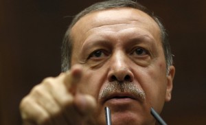 Turkey's Prime Minister Tayyip Erdogan addresses members of parliament from his ruling AK Party during a meeting at the Turkish parliament in Ankara