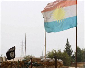 A Kurdish flag and a Islamic State flag flutter on each end of the Mullah Abdullah bridge in southern Kirkuk. Photo: Reuters