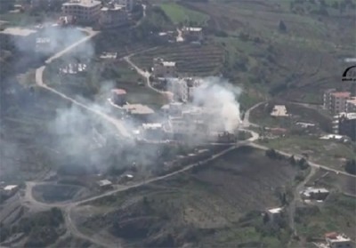 Smoke rises from building in Kessab during another attack by Turkish-backed militants in 2014