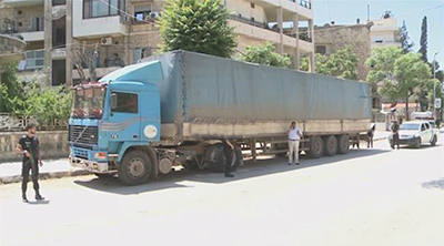 A frame grab of Syrian intelligence forces inspecting a captured Daesh-bound lorry full of medicine in Aleppo