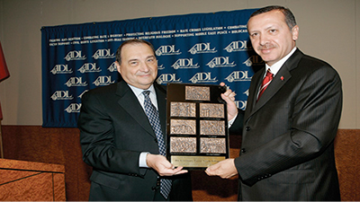 Turkey's Prime Minister Recep Tayyip Erdogan receives the ADL's 'Courage to Care' award from ADL National Director Abraham Foxman in New York