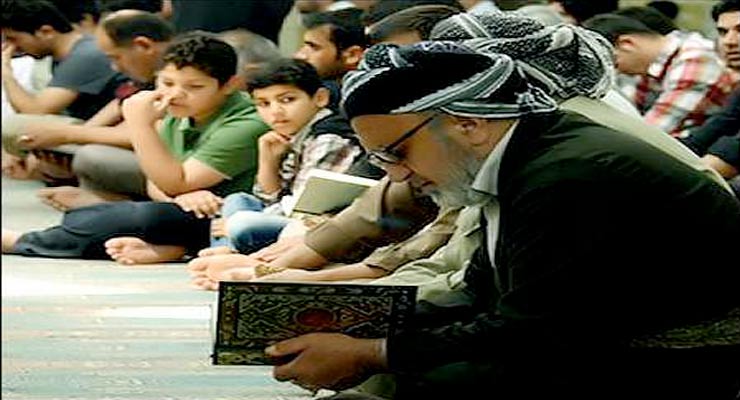 A Kurdish man reads the Quran in a mosque in Iraqi Kurdistan. Photo: Mariwan Naqshbandi/Rudaw