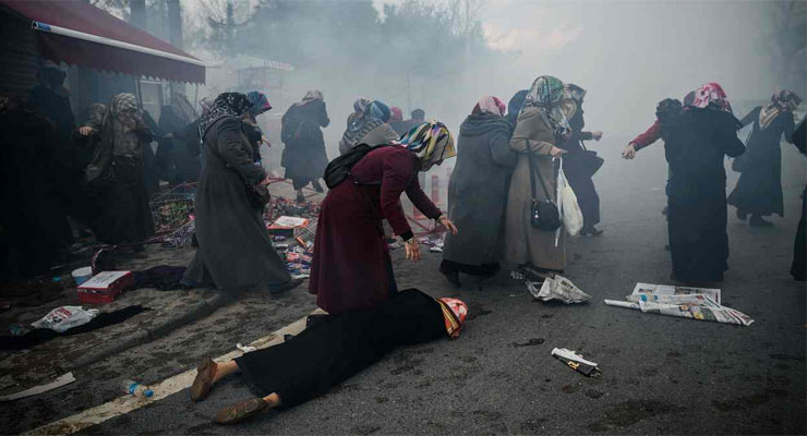 Women protesting against the seizure of the offices of the Zaman newspaper in Istanbul being dispersed by teargas. Photograph: Ozan Kose/AFP/Getty Images