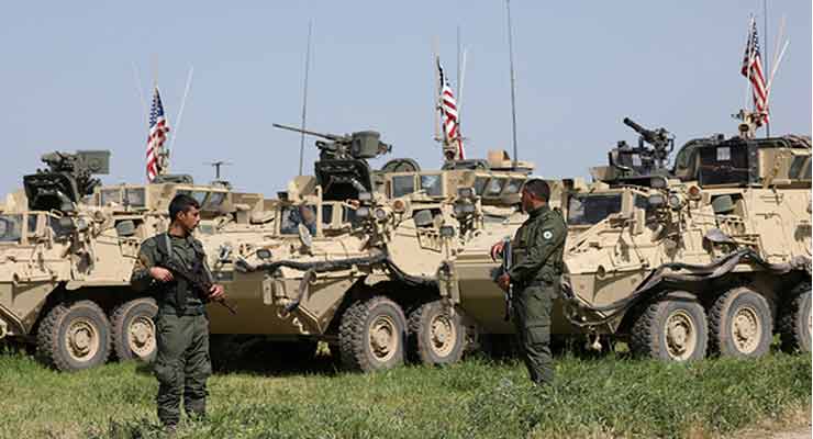 Kurdish fighters from the People's Protection Units (YPG) stand near US military vehicles in the town of Darbasiya next to the Turkish border, Syria, April 29, 2017. (photo by REUTERS/Rodi Said) Read more: http://www.al-monitor.com/pulse/originals/2017/05/turkey-united-states-trump-decision-arm-kurds-can-be-costly.html#ixzz4gvtbxCya