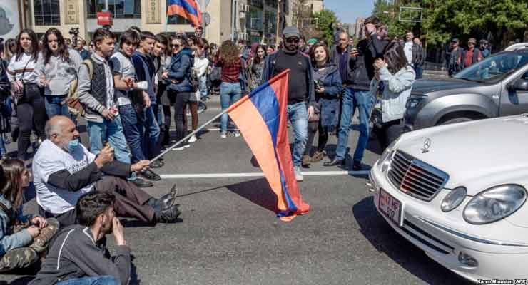 Opposition supporters block a street during a rally in central Yerevan on April 16.